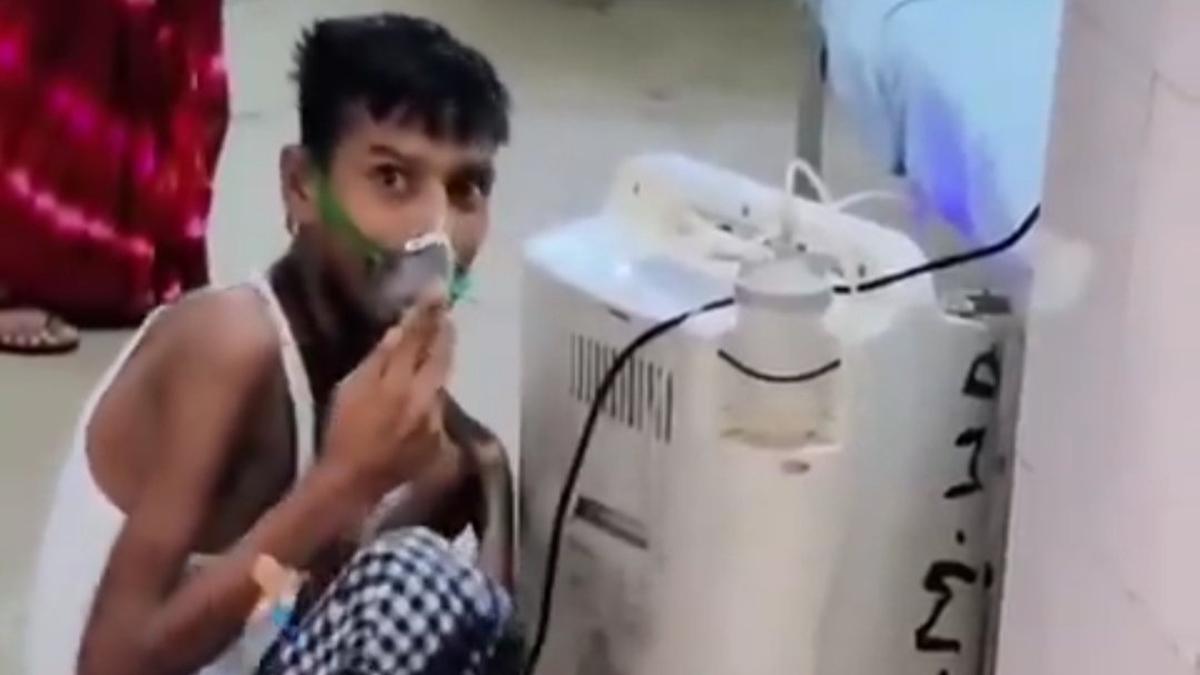 uproar-over-patient-in-oxygen-mask-sitting-on-the-floor-in-up.-azamgarh-hospital