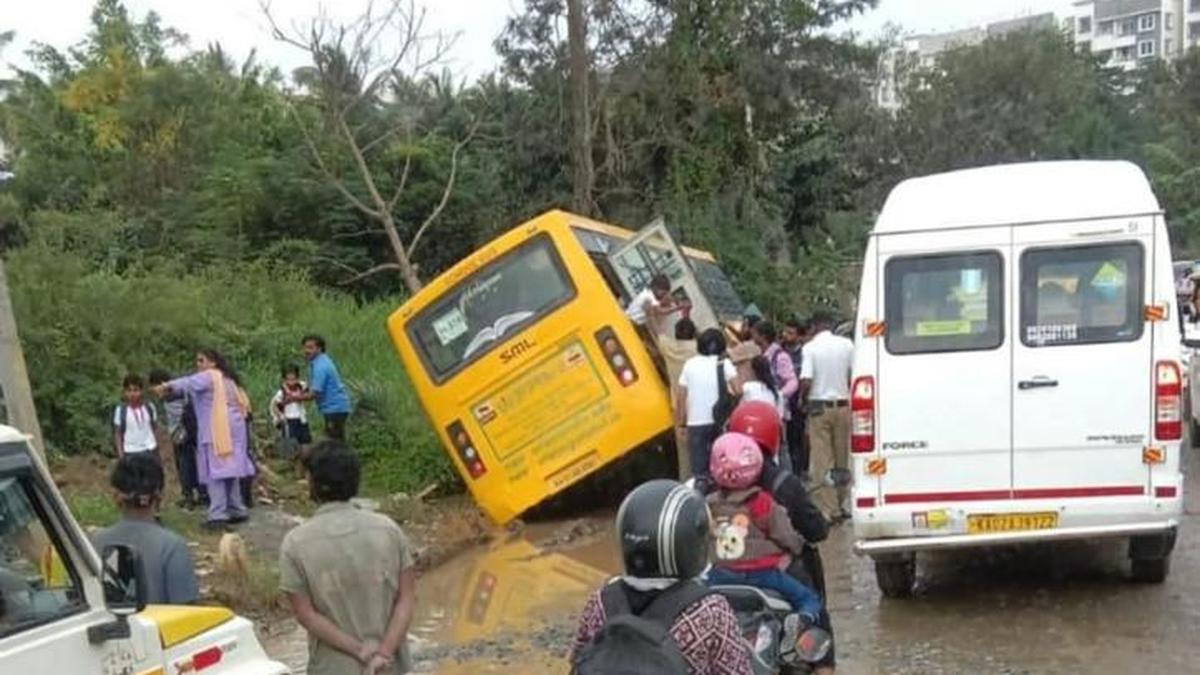 bus-carrying-school-children-in-bengaluru-tilts-after-wheel-gets-stuck-in-pothole
